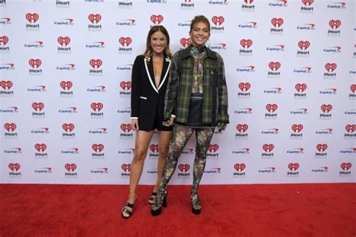 Becca Tilley & Hayley Kiyoko Make Their Red Carpet Debut As a Couple; Talk Music, Podcasting, & More ·