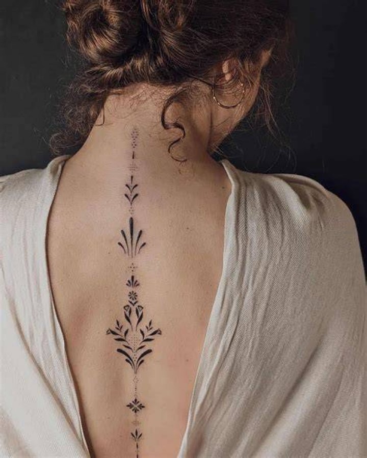 Enchanting Moon Phase Tattoos Down The Spine: A Cosmic Canvas
